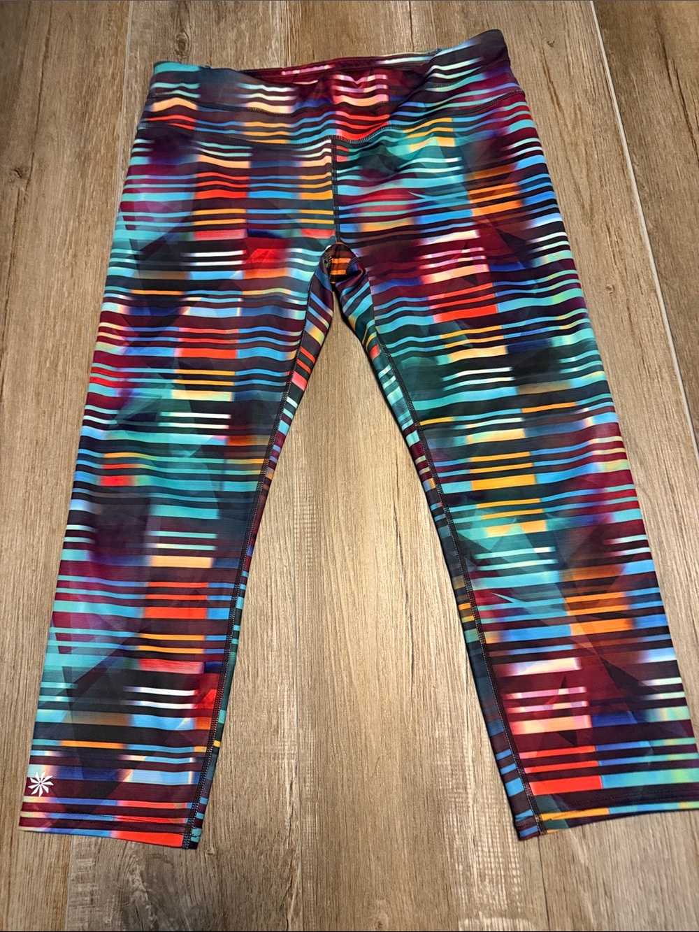 Athleta Laser Beam Sonar Capri Leggings featuring a vibrant multicolor pattern